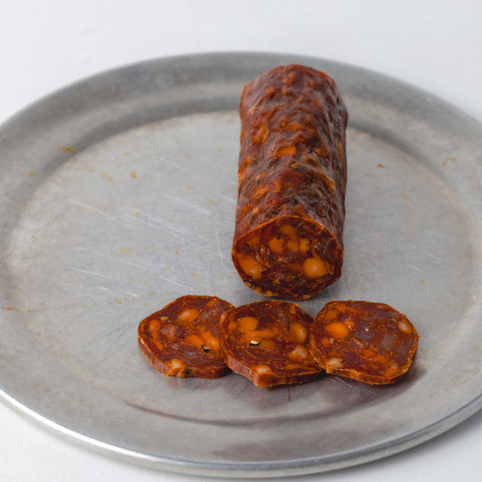 Devon Fire Chorizo, whole 100g stick with slices cut to show the inside