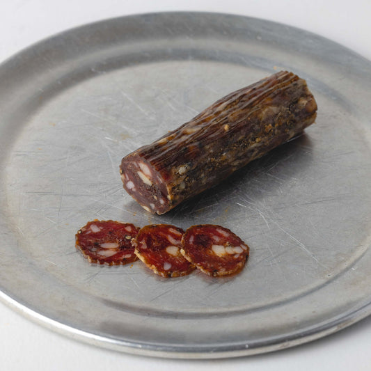 Devon Wagyu Salami, whole 100g stick with slices cut to show the inside